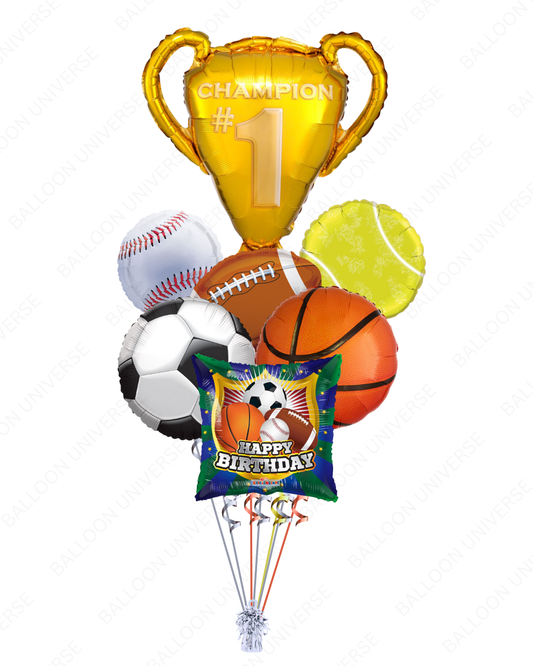 Sports-themed balloon bouquet with a 'Champion' trophy balloon, basketball, soccer ball, football, baseball, and tennis ball 